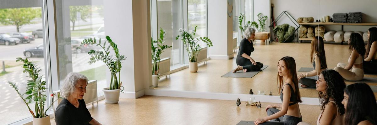 Wide view of a peaceful yoga studio environment